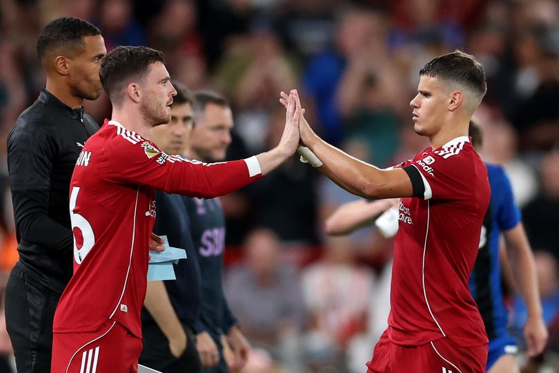 Andy Robertson replaces Milos Kerkez during the Premier League game between Liverpool and Bournemouth.