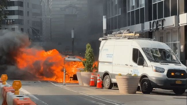 Explosion of flames bursts from MTA vehicle engulfed in fire in Manhattan