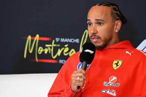 Lewis Hamilton speaking into a microphone