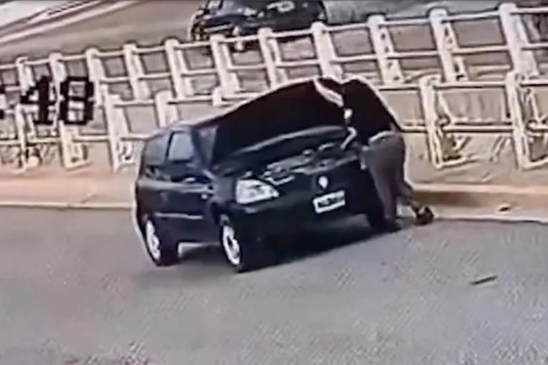 Horrifying moment driver run over by her own car while checking battery ...