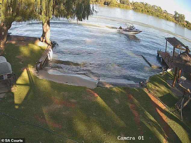 Police and paramedics were told two people had been struck by a boat, with CCTV footage from a riverside home capturing the moment of impact (pictured)