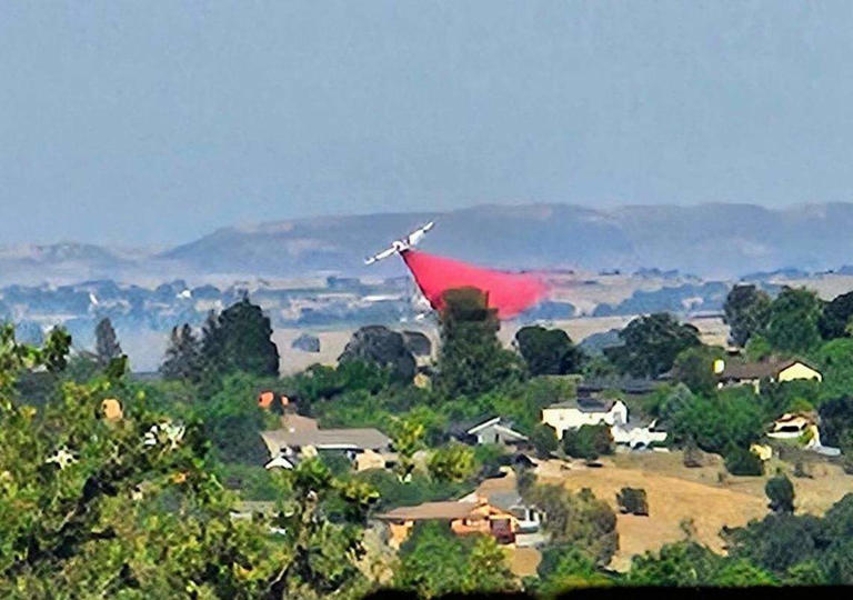 A Paso Robles vegetation fire threatened homes. What caused it?