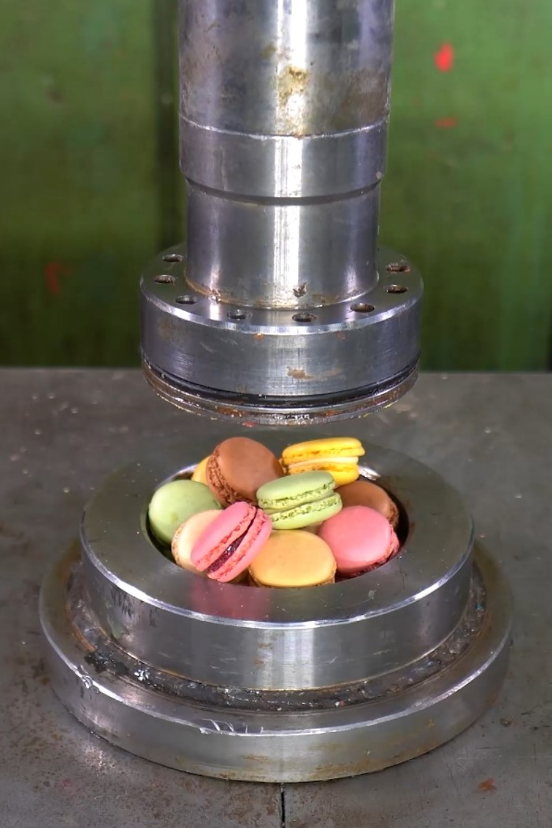 Crushing colorful macarons under hydraulic pressure