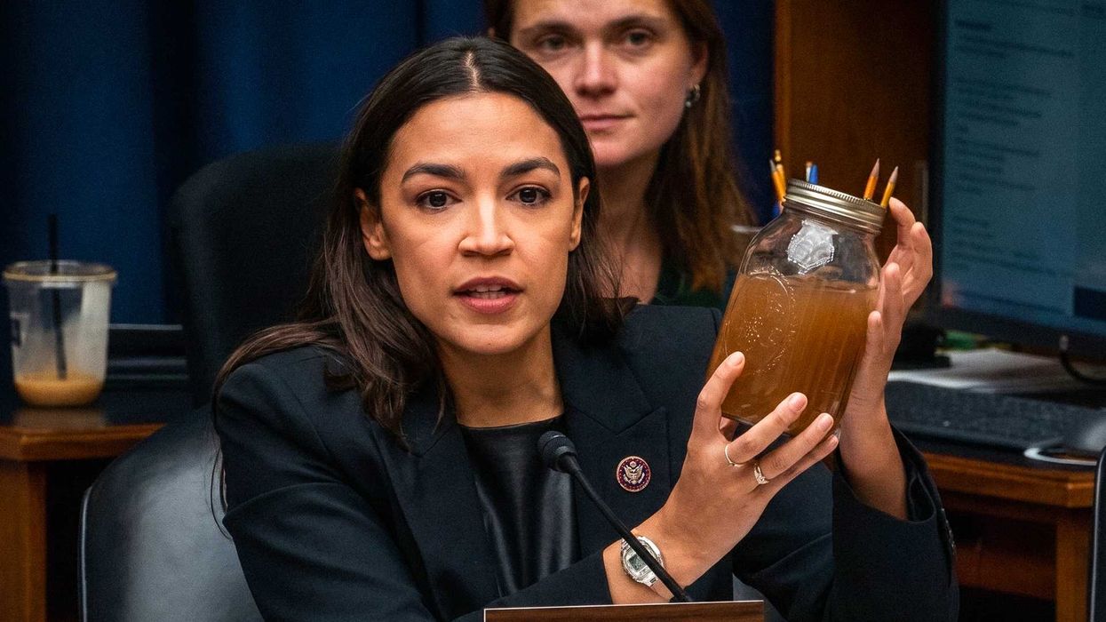 AOC brandishes jars of brown water at EPA official over pollution in ...