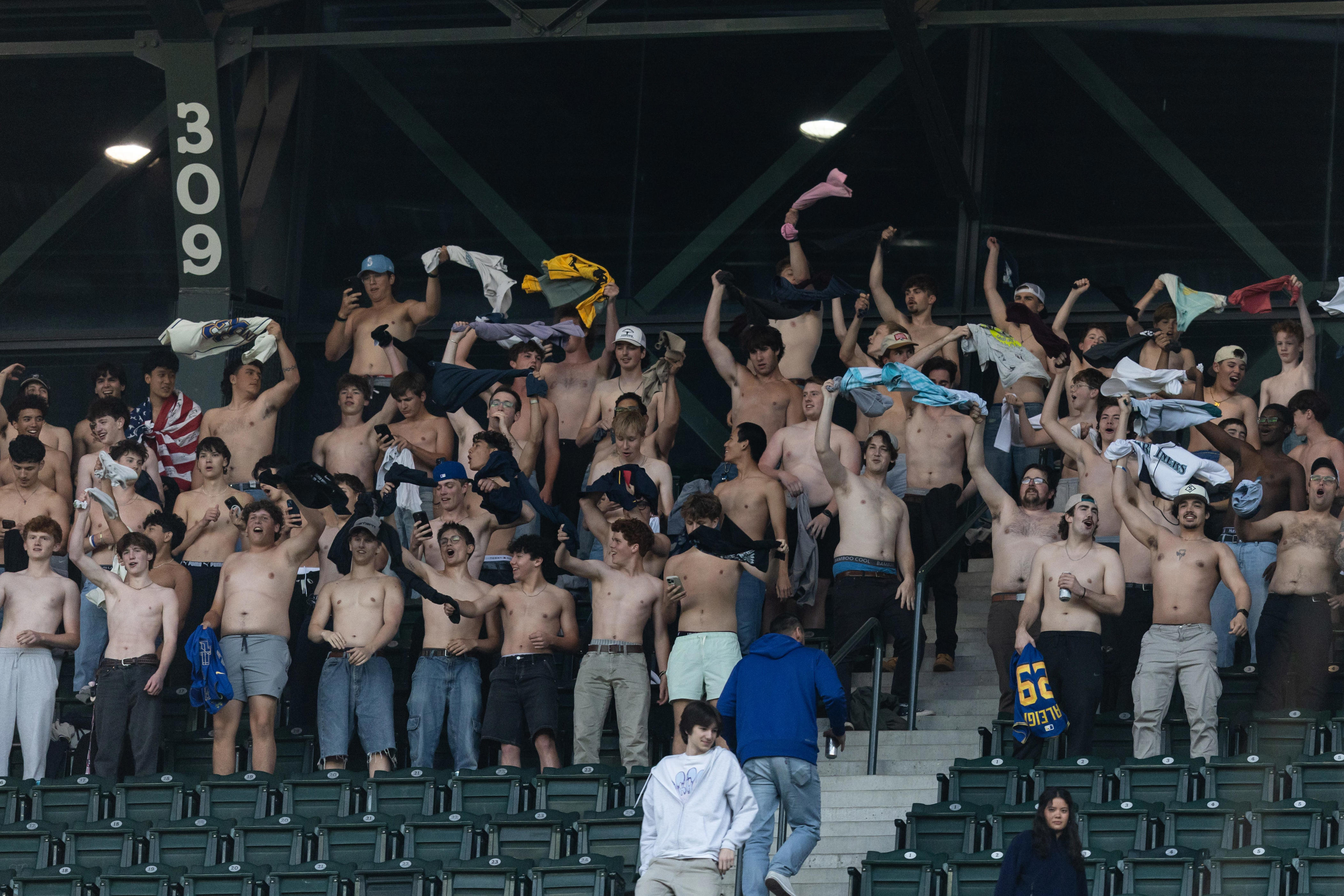 Tarps off! See the shirtless MLB fans going viral all over the country