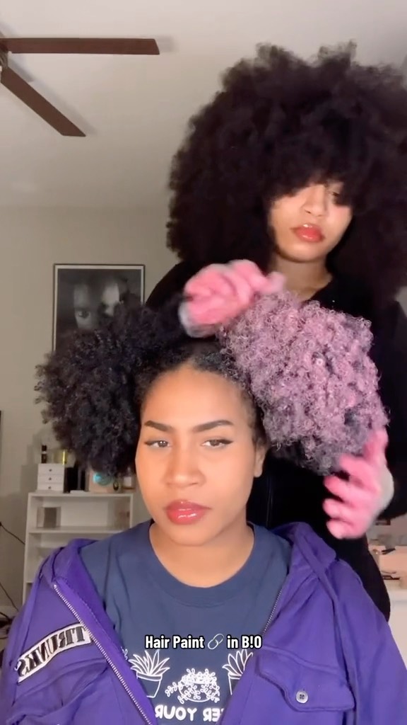 Turning twins hair pink with hair wax