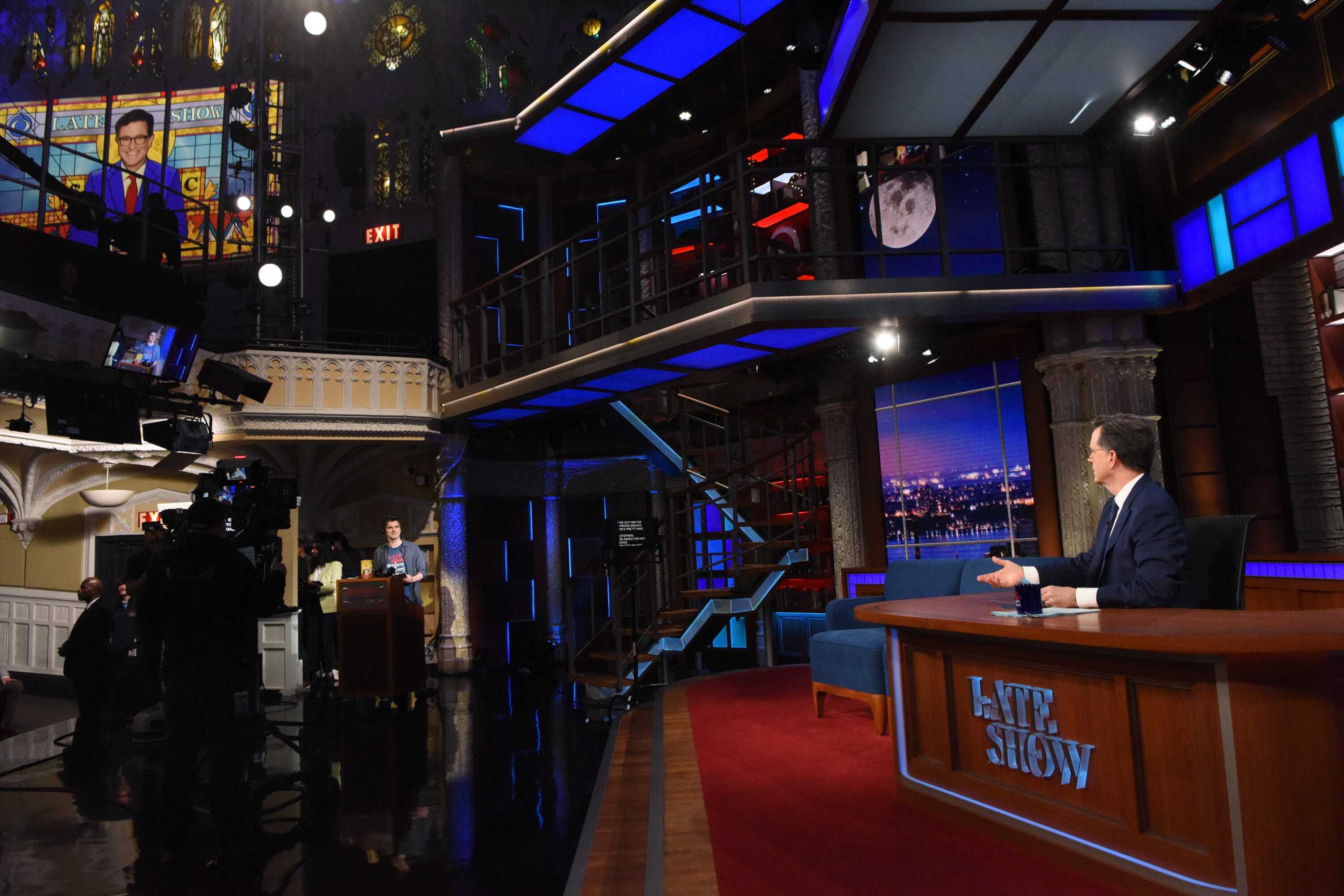 Stephen Colbert sits at his desk for the last time on set of "The Late Show with Stephen Colbert" finale.