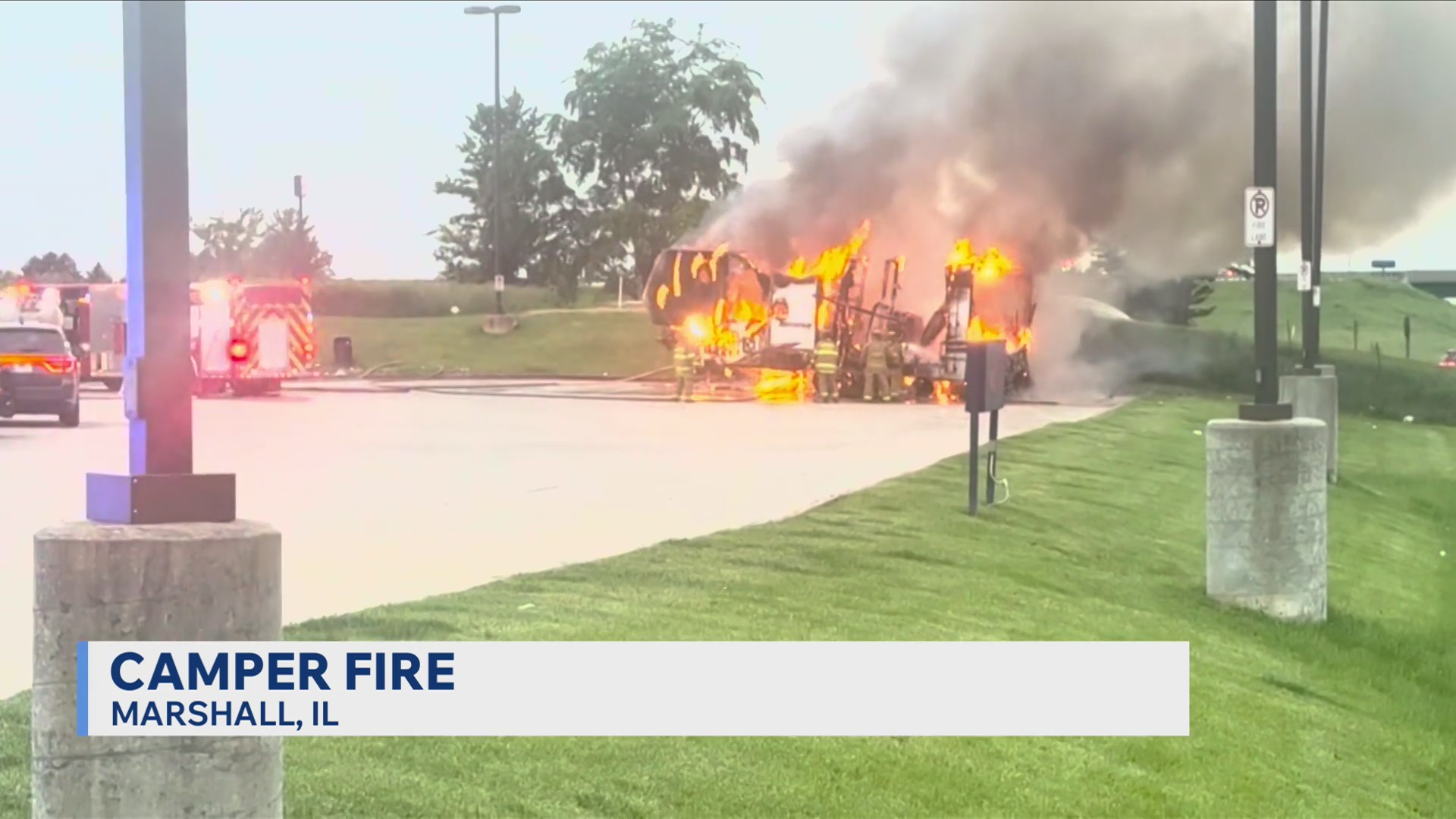 Firefighters battle camper fire