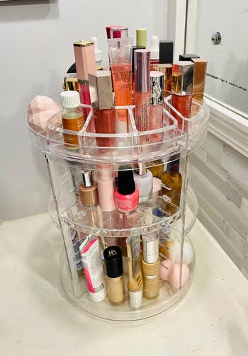 another reviewer's clear rotating organizer with various products on it