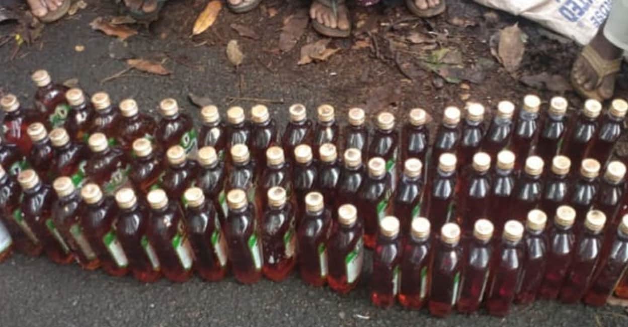 66 liquor bottles hidden in bushes found by women during road cleaning ...