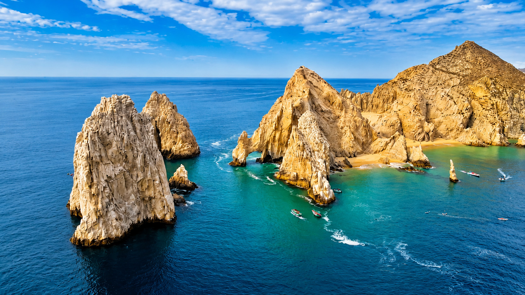 A hidden coastal paradise framed by ocean-carved rock formations
