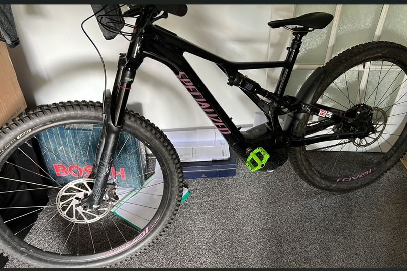 Boy robbed in city street after being pulled from bike by masked men