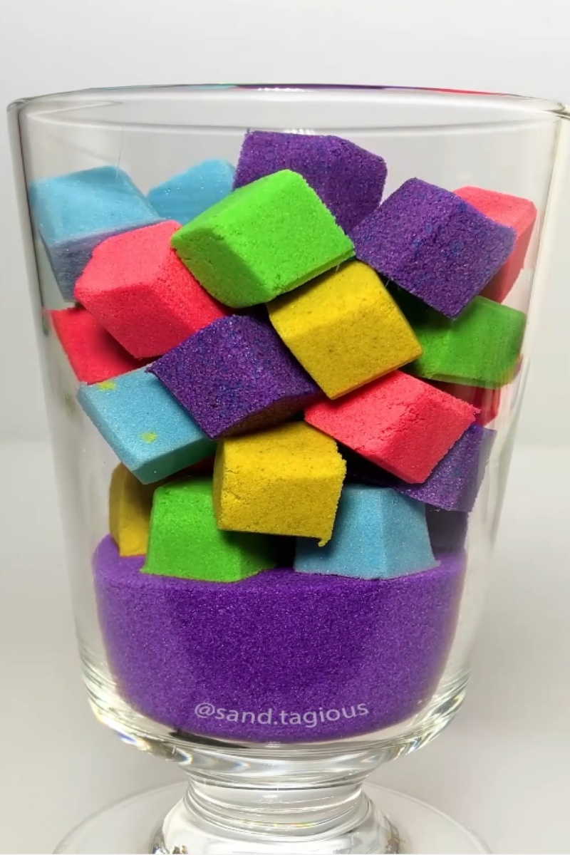 Colorful kinetic sand cube stack