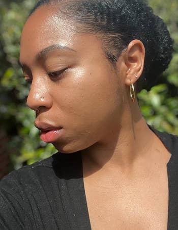 a reviewer wearing shimmering suncreen