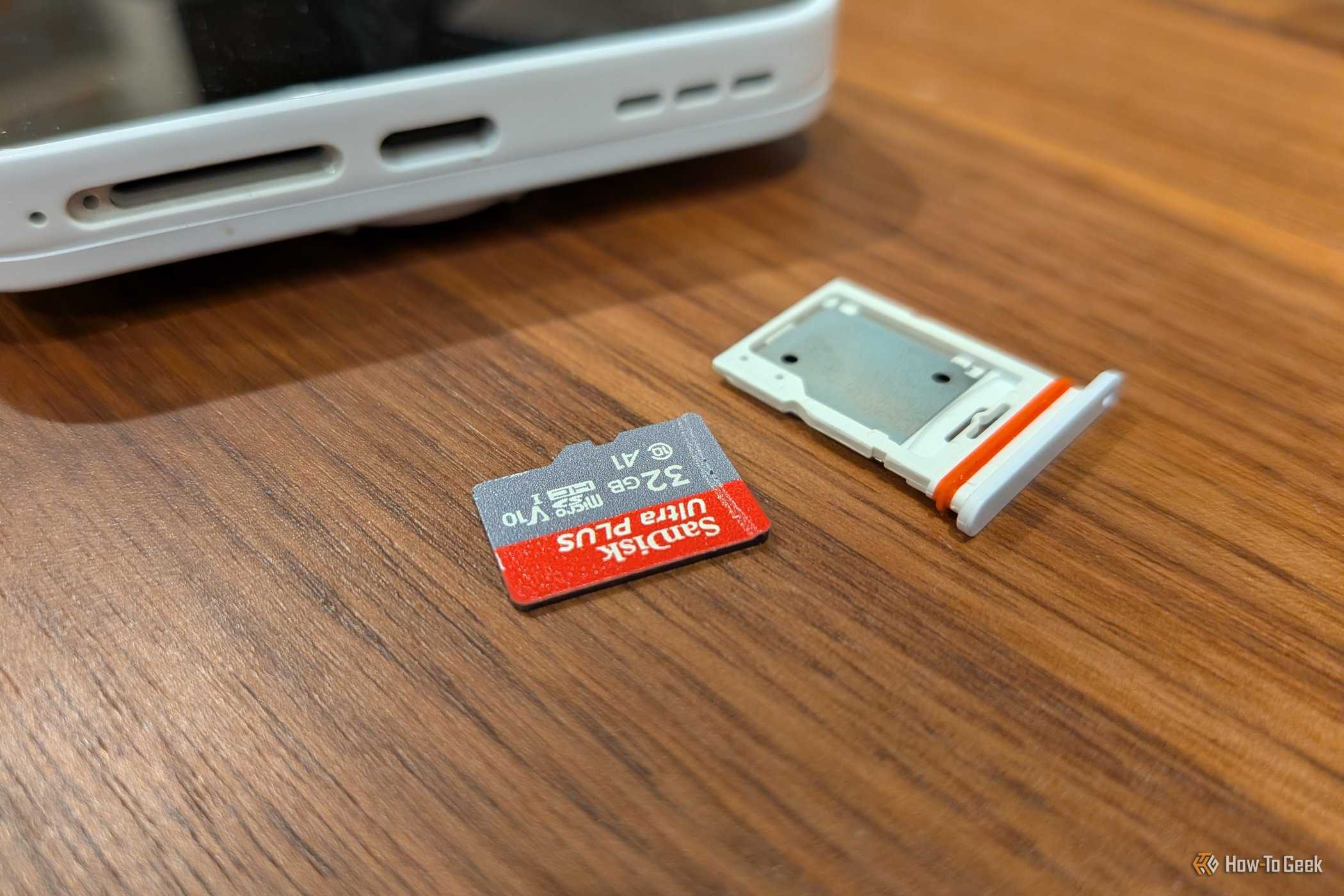 A microSD card next to the microSD card slot of a Fairphone (Gen 6).