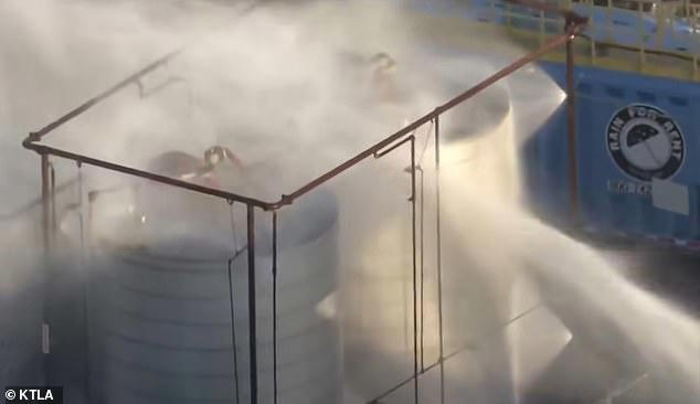 Panic as tens of thousands evacuated over fears that huge chemical tank ...