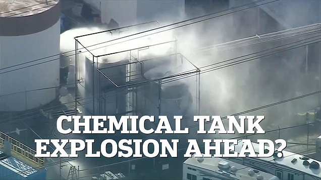 Smoke flies from chemical tanks that can explode at any moment