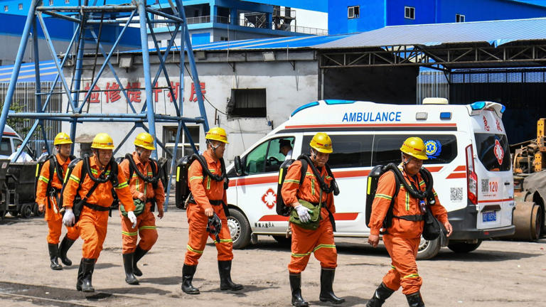 Rescue workers at the scene following an explosion at the Liushenyu coal mine. Pic: Xinhua via AP