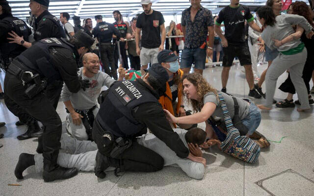 Spanish police beat and detain returning Gaza flotilla activists amid ...