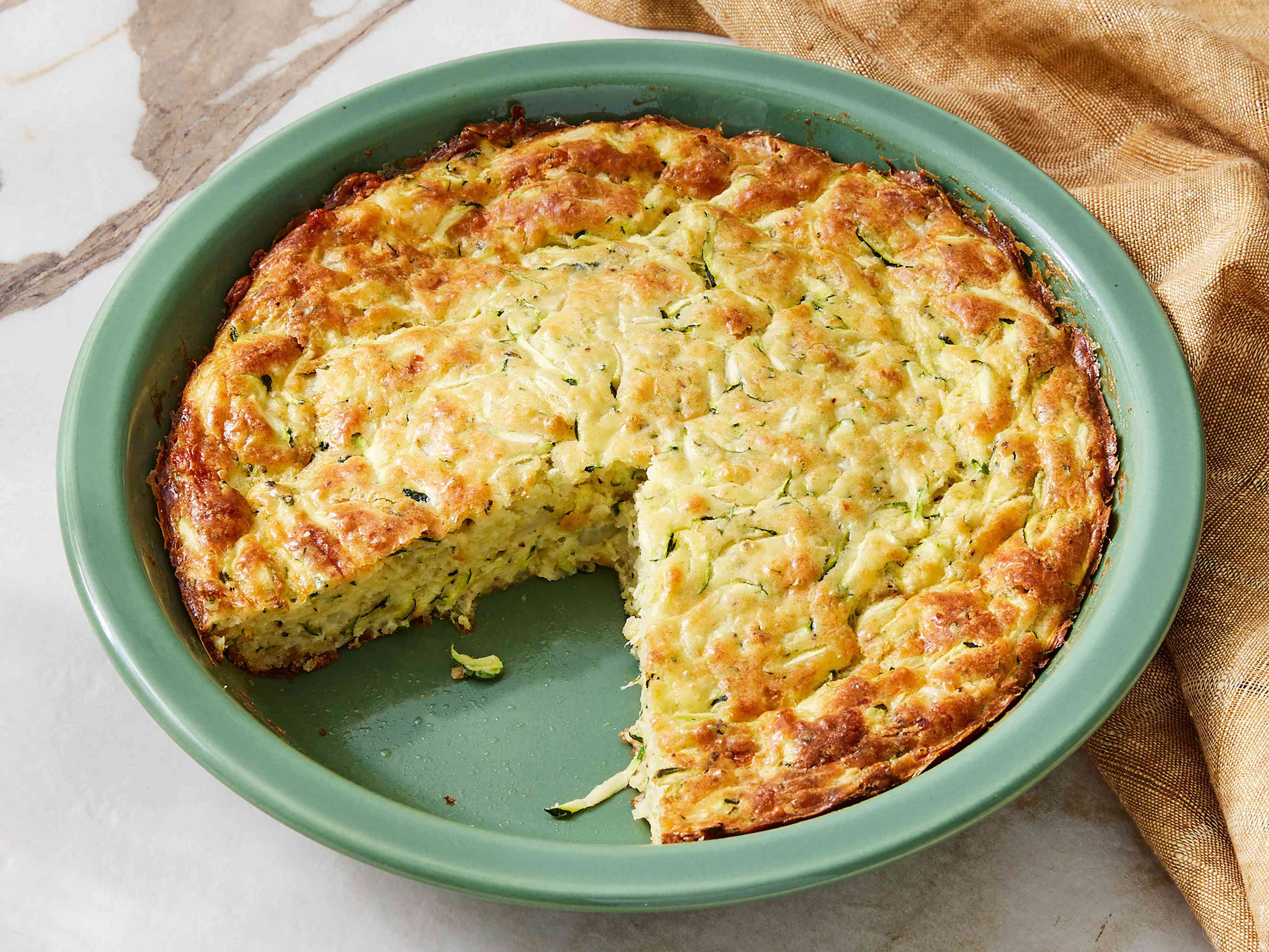 My grandma's easy Bisquick zucchini pie is a staple at my family potlucks
