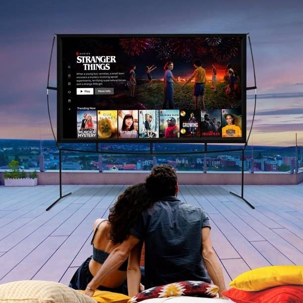 Couple watching movies on a projector screen