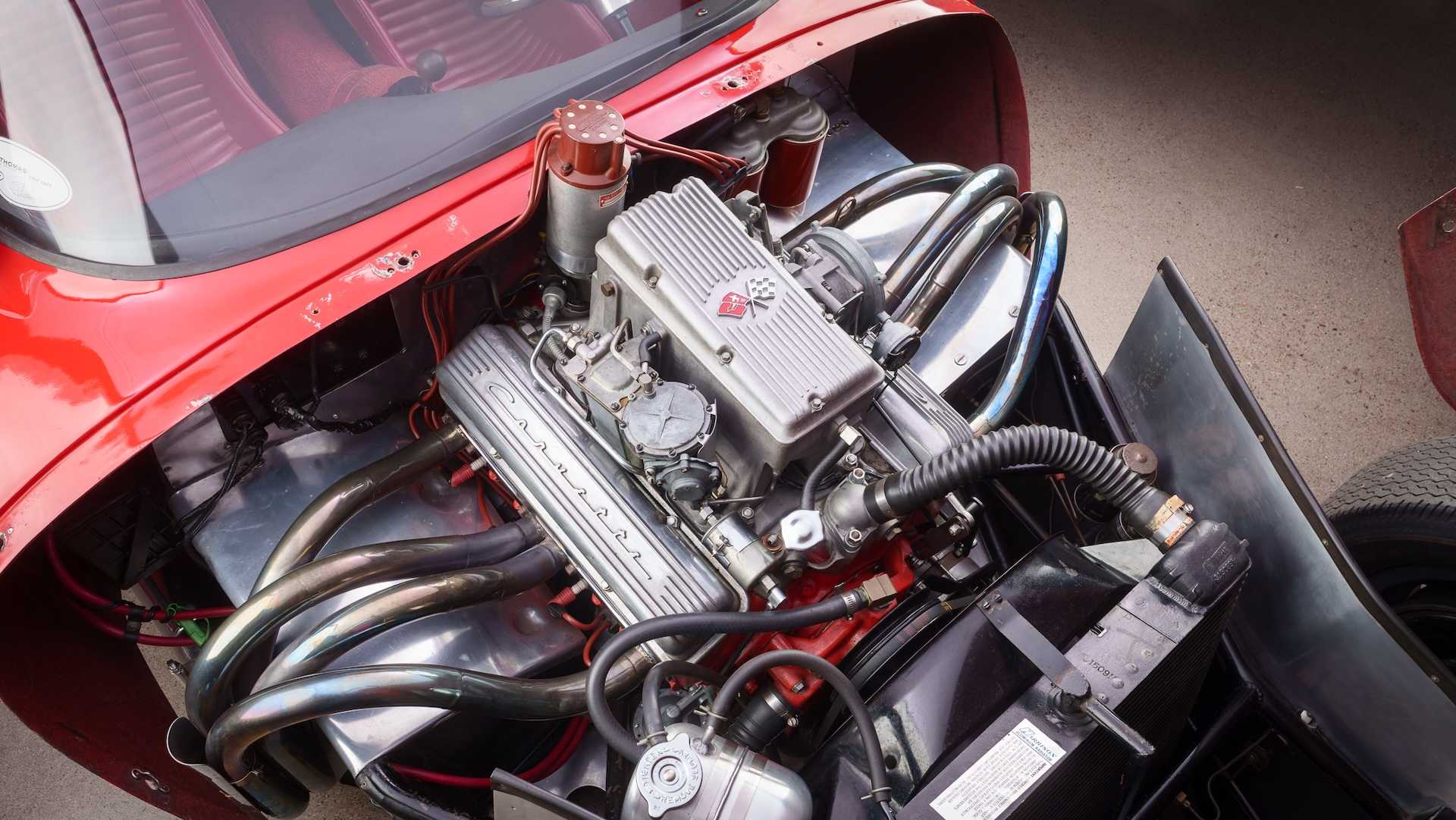 The 327 cubic inch V8 under the hood of a custom 1960s sports car