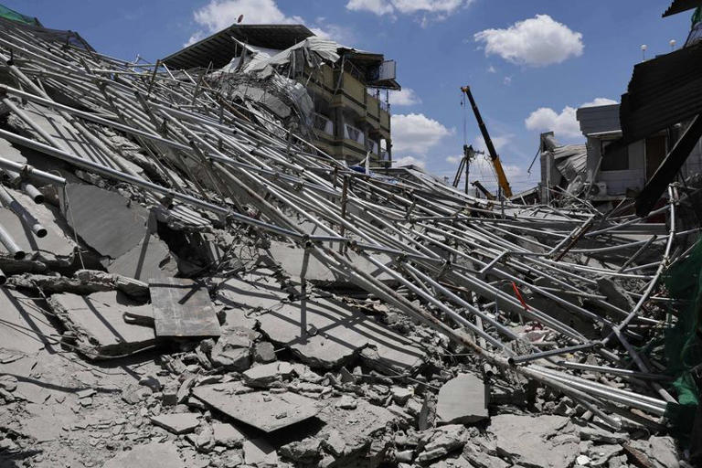 Frantic search as nine-storey building collapses with voices heard in ...