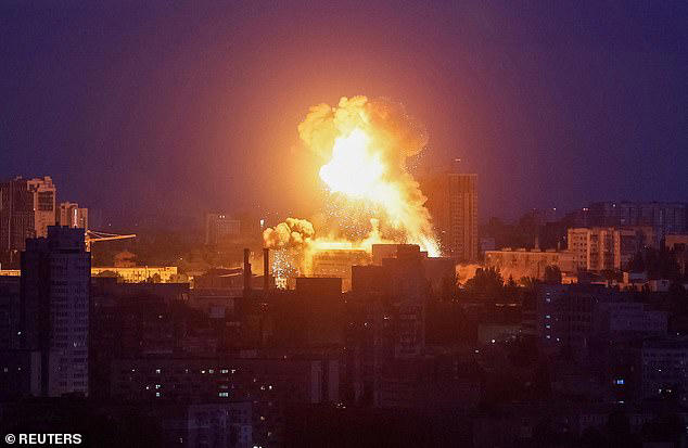 An explosion lights up the sky over the city during a Russian missile and drone strike, amid Russia's attack on Ukraine, in Kyiv, Ukraine May 24, 2026