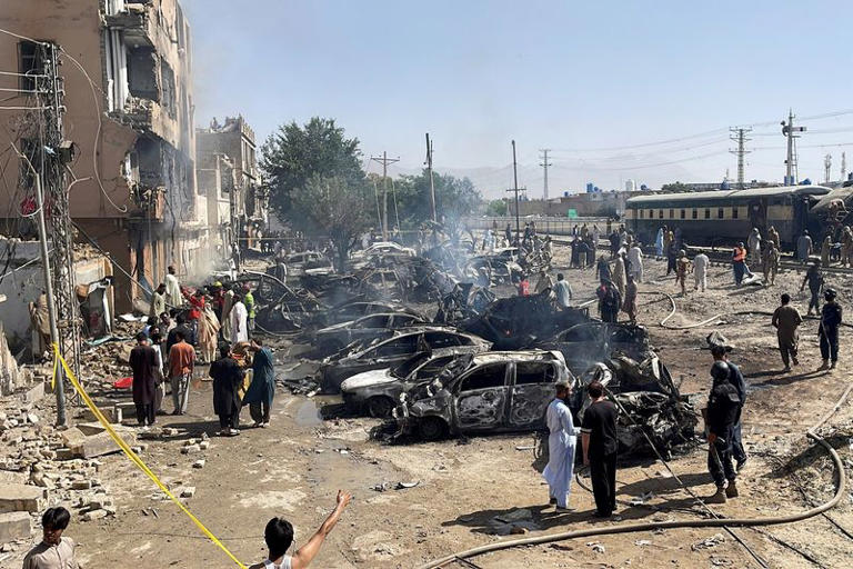 People and police officers gather after a blast near a railway track in Quetta, Pakistan, May 24, 2026. Picture taken with a mobile phone. REUTERS/Stringer