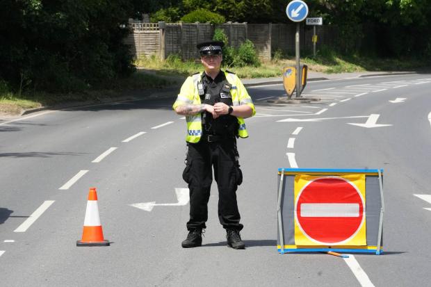 Woman dies following crash involving car and two motorcycles