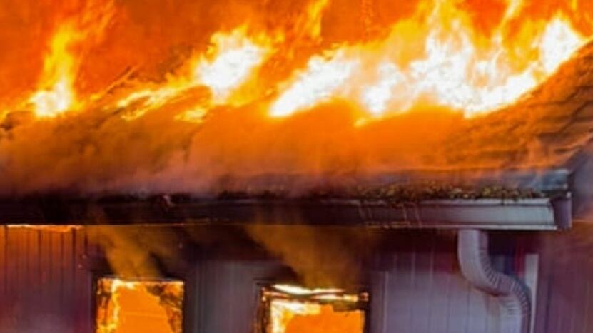 KCFD battles early morning house fire that threatened neighboring home