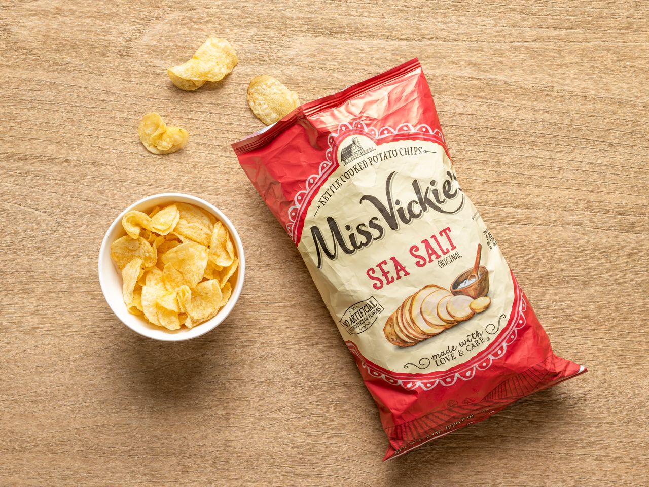 A bag of Miss Vickie's kettle cooked sea salt potato chips with a small bowl of chips