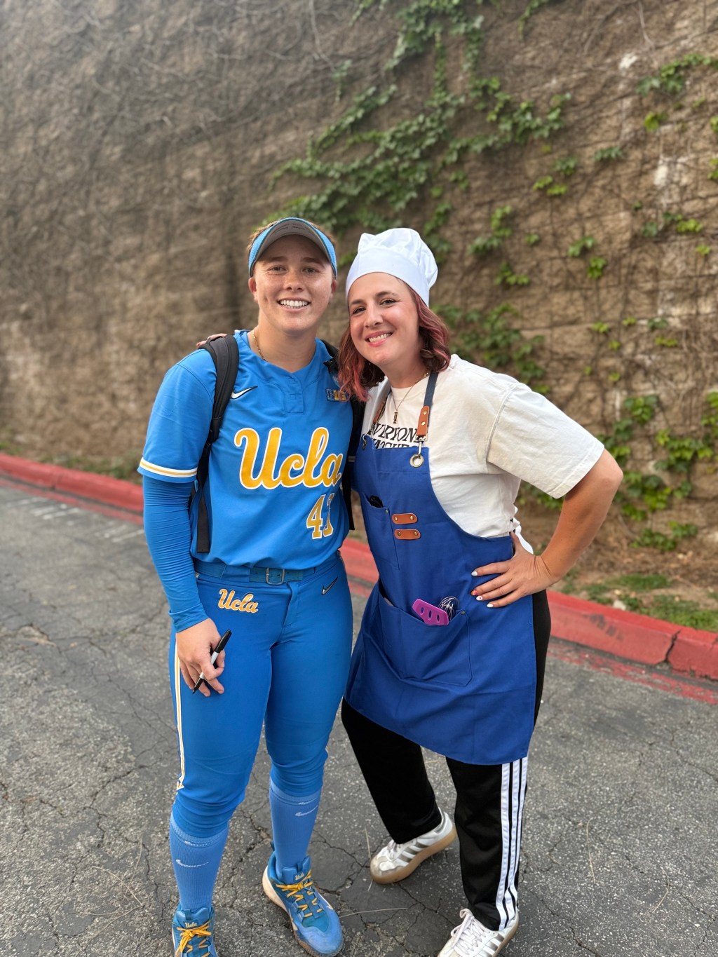UCLA slugger Megan Grant’s super fan gets cooking with creative outfit