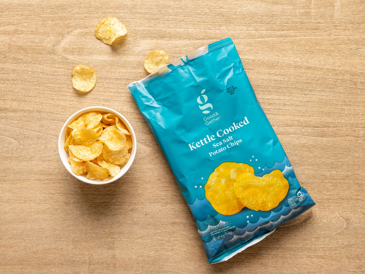 A bag of Target Good & Gather kettle cooked sea salt potato chips with a small bowl of chips