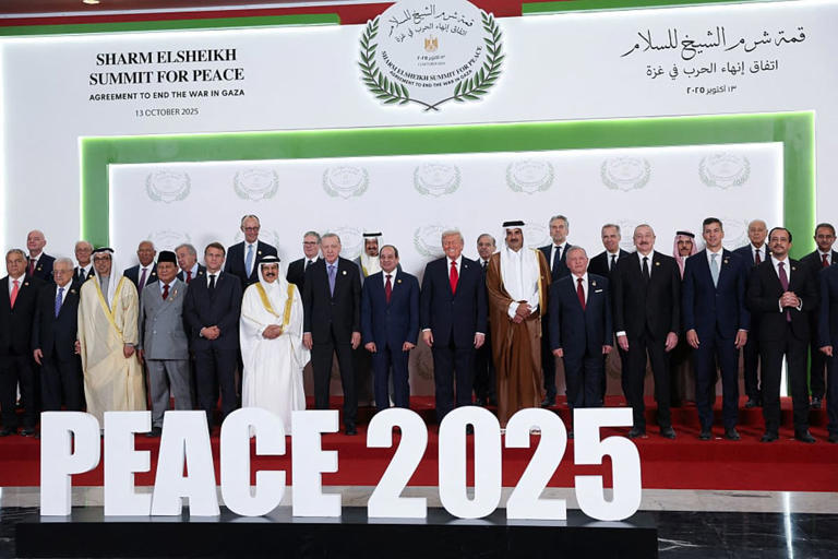World leaders including President Donald Trump, Egypt's President Abdel Fattah al-Sisi, British Prime Minister Keir Starmer, Canadian Prime Minister Mark Carney, French President Emmanuel Macron, German Chancellor Friedrich Merz, Hungarian Prime Minister Viktor Orban, Indonesian President Prabowo Subianto, Jordan's King Abdullah, and Turkish President Tayyip Erdogan, pose for a family photo, at a world leaders' summit on ending the Gaza war on October 13, 2025 in Sharm El-Sheikh, Egypt (Suzanne Plunkett - Pool / Getty Images)