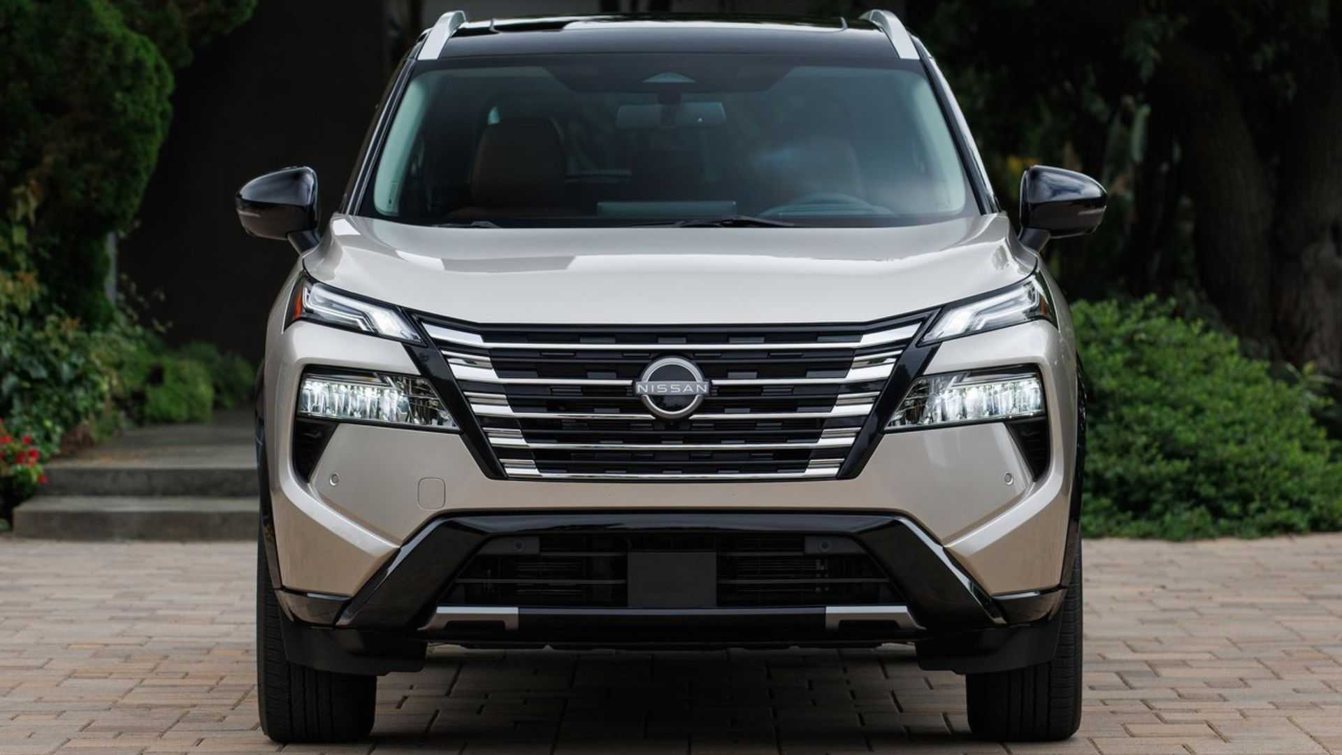 Static front-end shot of a gold 2024 Nissan Rogue.