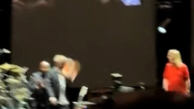 Moment Eric Clapton is struck by vinyl record launched by someone in ...