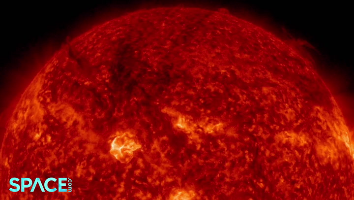 Strong solar flare spews dark plumes of plasma, solar storm earth-bound
