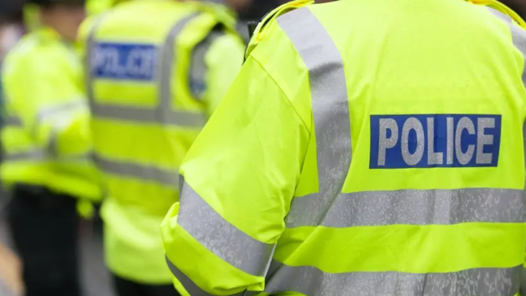 Serving police officer charged with assault