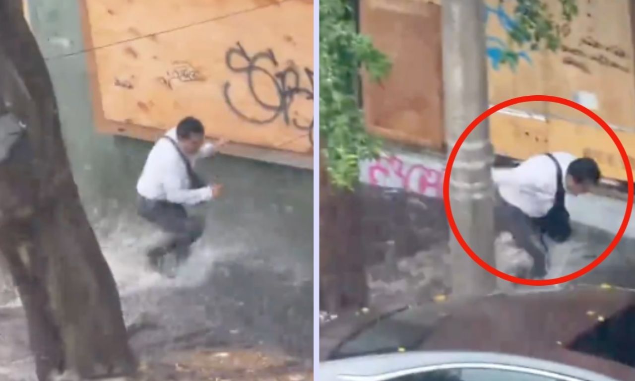 Hombre trata de cruzar una calle inundada tras fuerte diluvio en Puebla ...