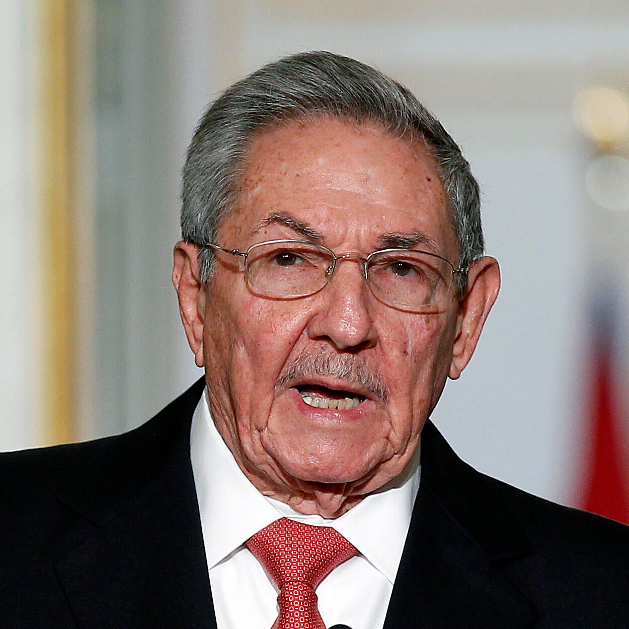 FILE - Cuba's President Raul Castro listens to the Cuban and Venezuelan national anthems during his welcome ceremony at the Miraflores presidential palace, March 17, 2015, in Caracas, Venezuela.