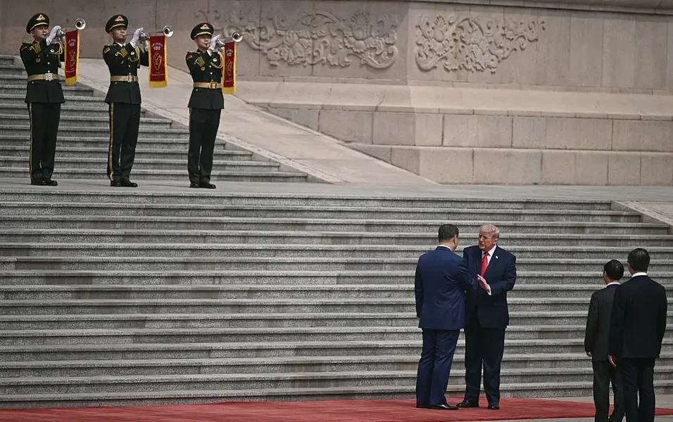 Trump and Xi's handshake fuels debate over power dynamics