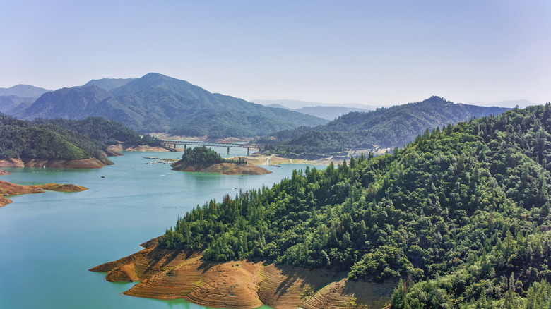 California's Largest Man-Made Lake Has Miles Of Shoreline Camping, Caverns, And Houseboat Vacation Rentals