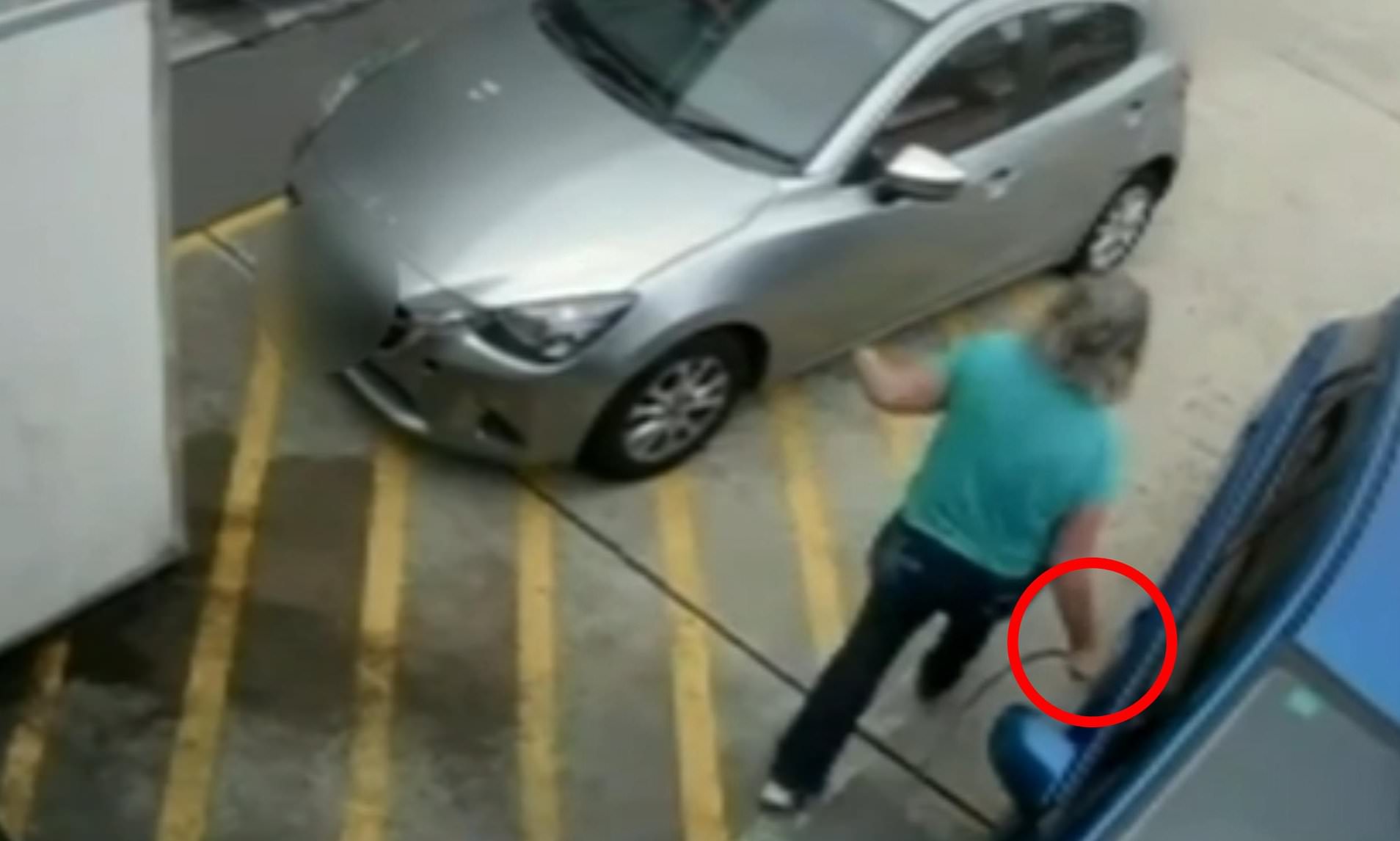 Woman's brazen act at a service station sparks police manhunt