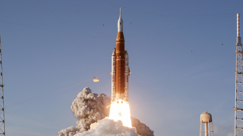 Why do rockets perform a rolling motion after launch?