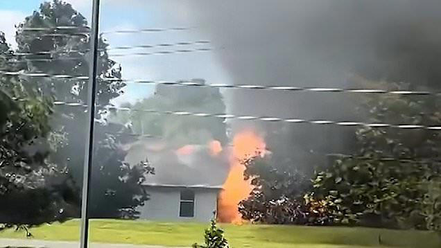 Two killed after plane crashes into house with family inside