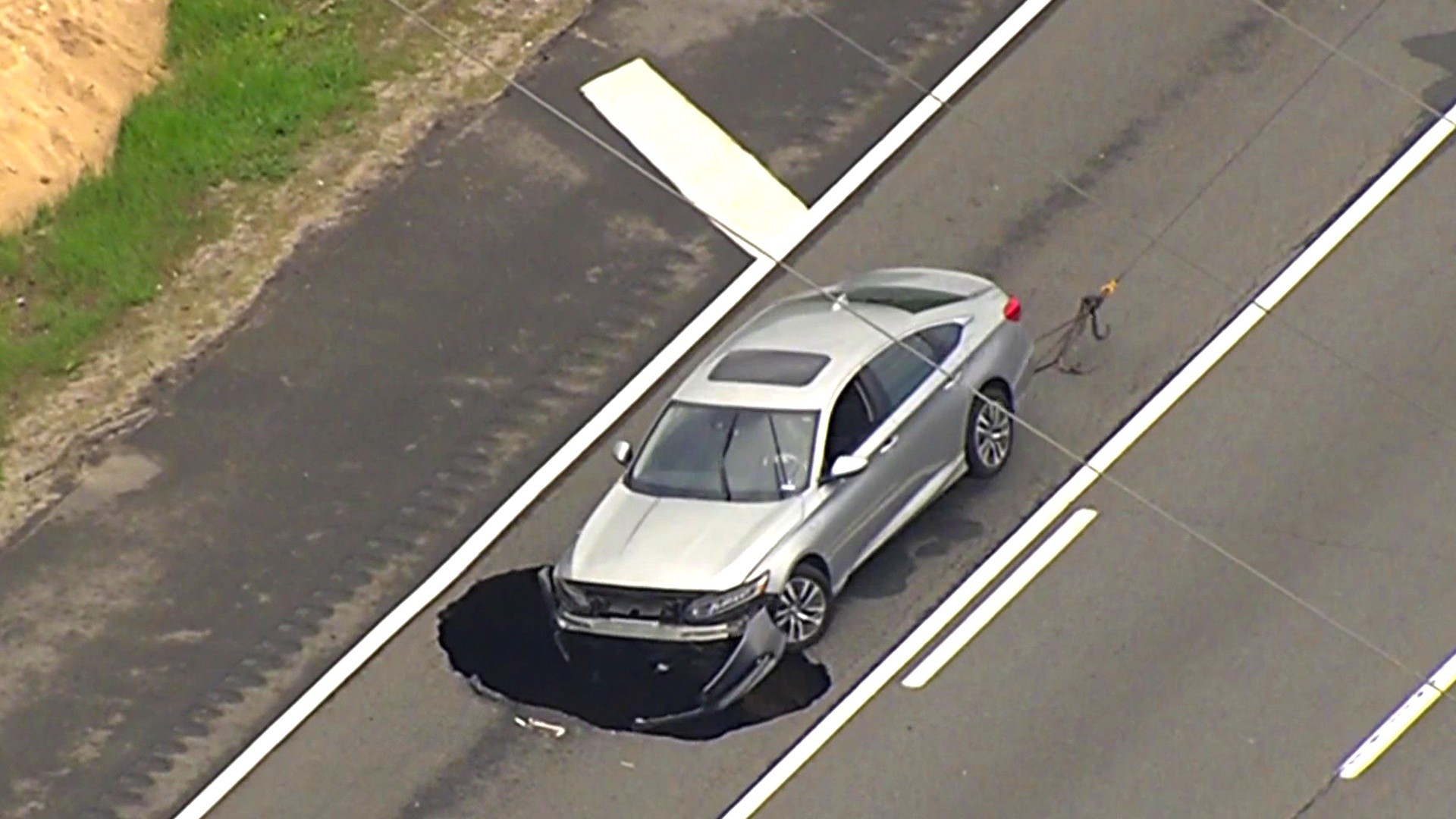 Massive sinkhole nearly swallows car on Long Island Expressway