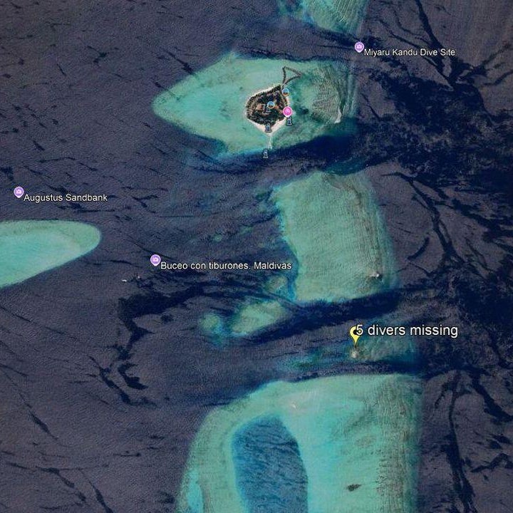 A tourist, along with guides, returns after an open-water diving session near Rasfannu Beach in Malé on May 15, 2026. Rescue teams in the Indian Ocean archipelago of the Maldives searched for on May 15 for the bodies of four missing Italians following the country's deadliest diving accident, officials said.
