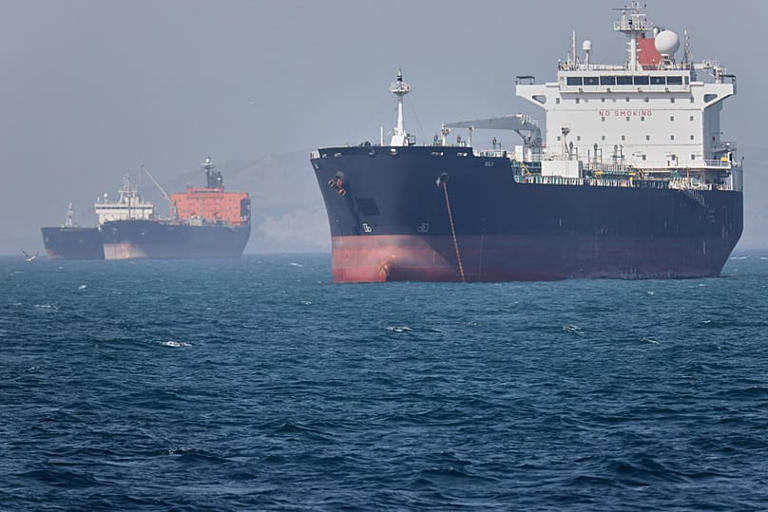 Oil tankers sit at anchor offshore in the Strait of Hormuz off Bandar Abbas, Iran, Saturday, May 2, 2026. Amirhosein Khorgooi/AP