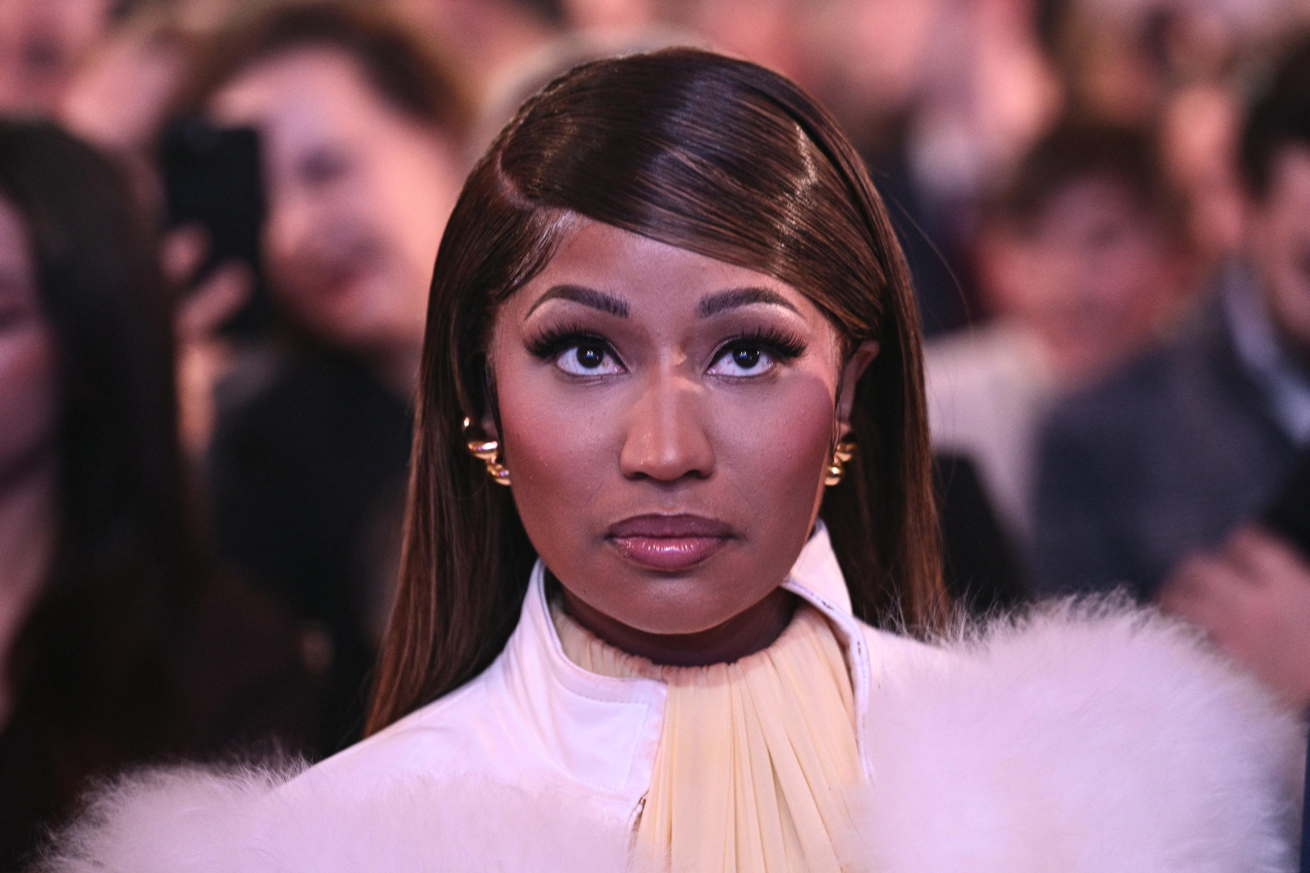 Nicki Minaj looks on as President Donald Trump speaks about Trump Accounts at the Andrew W. Mellon Auditorium in Washington, D.C., on Jan. 28, 2026.